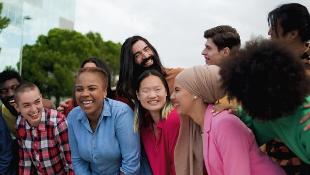 Multiethnic young people having fun together outdoor - Diverse friends youth community