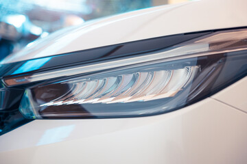 Closeup detail of headlight of auto car consist of led bulb, signal indicator turn light, lamp...