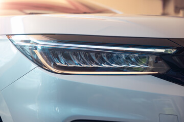 Closeup detail of headlight of auto car consist of led bulb, signal indicator turn light, lamp...