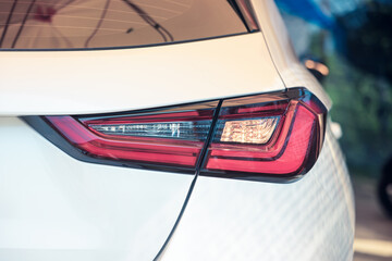 Detail of automotive lighting or vehicle part at back, rear view of auto car with tail or stop...