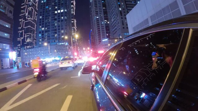 Hyperlapse car driving on the street in Dubai city at night. Side car view driving in Dubai UAE at night