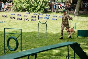 Cynologist with a dog. Service Dog Breed English Cocker Spaniel Dog.