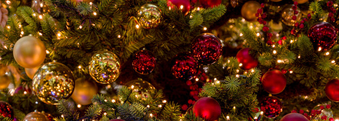 Obraz na płótnie Canvas Defocused christmas tree with balls for text.Blurred image
