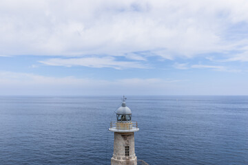 Santa Catalina lighthouse was inaugurated in 1862 with oil lamp and since 1957 lighthouse has had electricity. Cape El Cabo Antzoriz, Biscay, Basque Country - obrazy, fototapety, plakaty