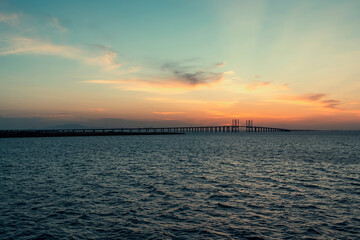 Fototapeta na wymiar Qingdao Jiaozhou Bay Bridge and dusk sunset