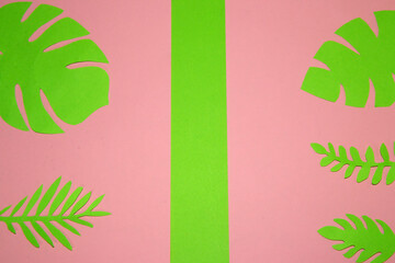 pink green background with green tropical leaves, lots of copy space, creative tropical design