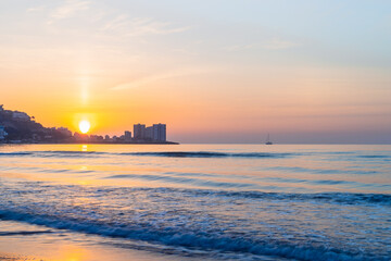 Naklejka na ściany i meble sunrise in front of the sea
