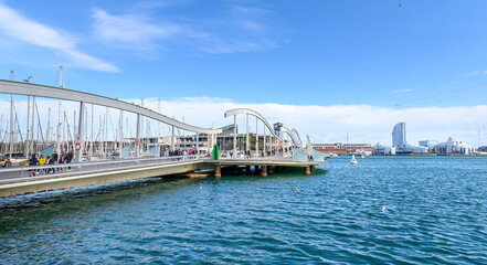 Beautiful ships and yachts in marina Rambla de Mar in Port Vell, Barcelona, Spain