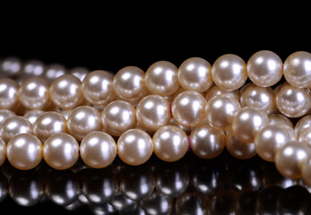 Pearl necklace on a black background