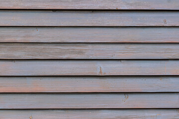 Surface made of wooden, horizontal slats of planks.