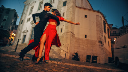 Beautiful Couple Dancing a Latin Dance on the Quiet Street of an Old Town in a City. Sensual Dance by Two Professional Dancers in the Evening in Ancient Culturally Rich Tourist Location.