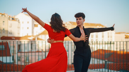 Beautiful Couple Dancing a Latin Dance Outside the City with Old Town in the Background. Sensual...