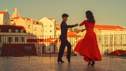 Beautiful Couple Dancing a Latin Dance Outside the City with Old Town in the Background. Sensual...