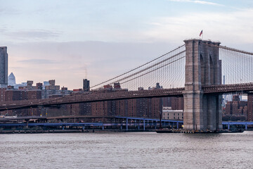 View of Manhattan and the Brooklyn Bridge and the FDR drive from the East River looking North.
