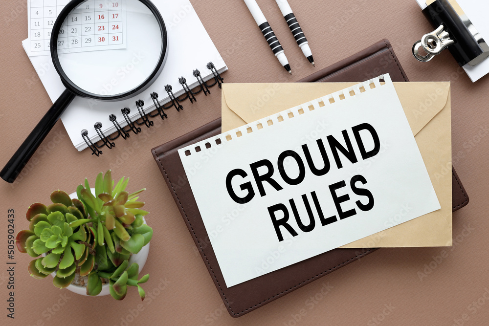 Poster ground rules. text on paper on an envelope and diary on the desk