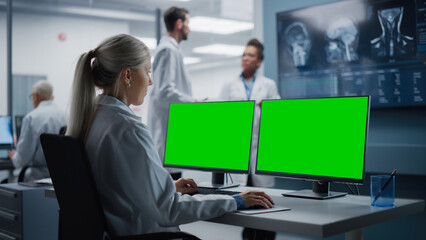 Hospital Research Lab: Female Medical Biotechnology Scientist Working on Green Screen Chroma Key...