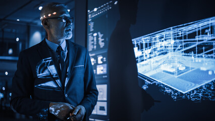 Real Estate Architectural Conference Meeting. Senior Architect Presents Building Construction to a Diverse Group of Designers, Developers, Investors. TV with 3D Model of Sustainable Housing Project