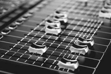 a mixing console as black and white image