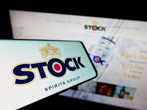 Stuttgart, Germany - 05-15-2022: Mobile phone with logo of British company Stock Spirits Group plc on screen in front of business website. Focus on center-left of phone display.