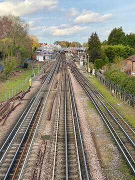 Railway Train Tracks with Train Platform in the Distance.