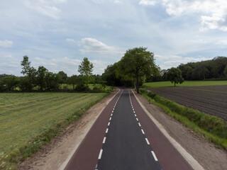 Fototapeta na wymiar Country road at Zwiepselaan between Zwiep and Lochem in Gelderland, the Netherlands