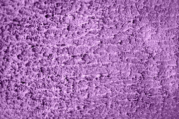 Concrete lilac wall background on the street.