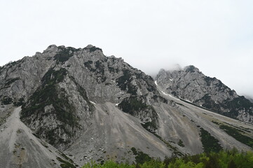 Mountain landscape at cloudy day. Stone and rocks. The Karawanks mountain range on the border between Slovenia and Austria. Alps.	