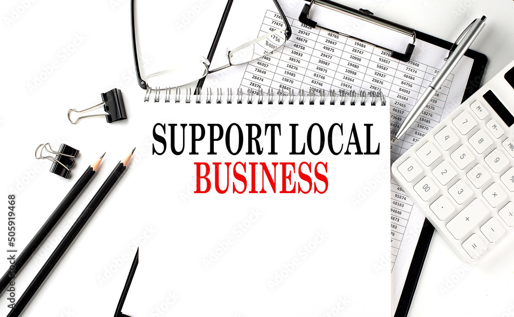 Poster support local business word on notepad with clipboard , chart and calculator, business concept
