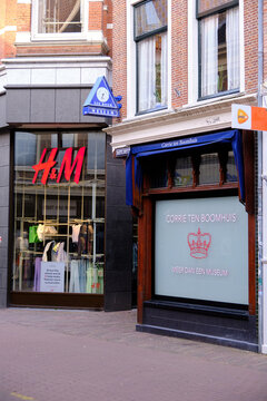 Haarlem, The Netherlands - April 11, 2022: Corrie ten Boom house next to H&M fashion store in the city centre.