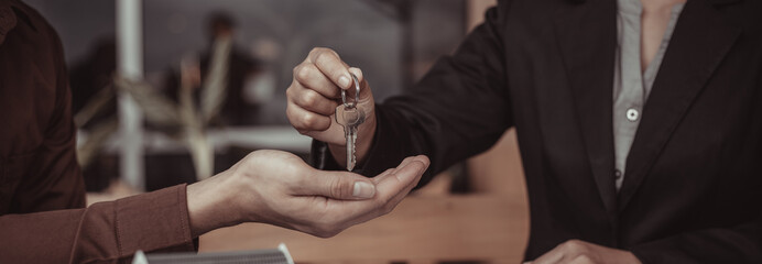 Real estate agent or sales manager has offered home sales and explained the terms of signing the house purchase contract and free home insurance, Finance and after-sales service concept.