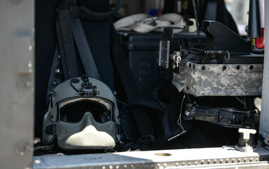 Detail view from inside a United States Airforce helicopter with view of the pilot helmet and...