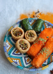 Knafeh traditional Middle Eastern dessert made of cheese, honey syrup and spun pastry. Classic...