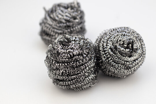 three steel wool scourers isolated on white