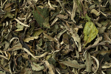 Chinese Bai Mudan, Pai Mu Tan dried tea leaves close up full frame as background 