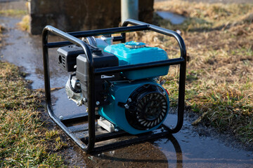 Gasoline electric generator on the street to supply voltage.