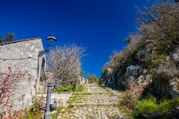 The small village of Tolfa, in Lazio. The cobblestone alley that climbs steeply to the Sanctuary of...