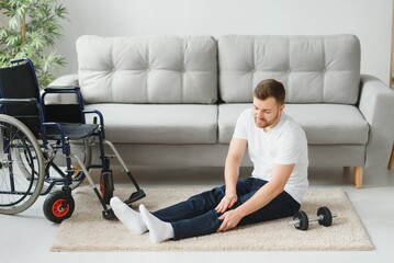 Disabled sportsman doing stretching and exercises on wheelchair background. Life of a disabled person