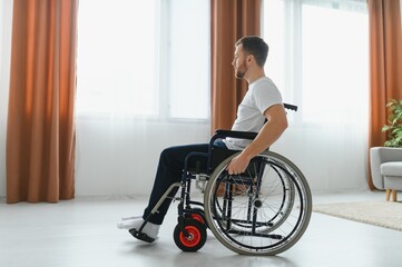 Young handsome man in wheelchair