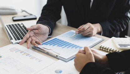 Brainstorm team, Marketers and financial accountants are discussing and analyzing charts to plan strategies to meet customer needs, Computer technology for business concept.