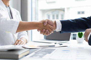 Greeting and meeting, business partners as partners shaking hands to congratulate each other to work together, Building friendship in real estate investment , handshake concept.