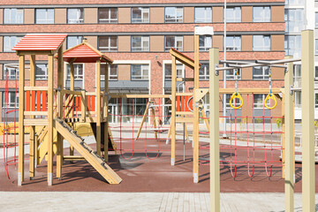 Fototapeta na wymiar Colorful playground on yard. soft coating for children's playgrounds from rubber crumb. court coverage.
