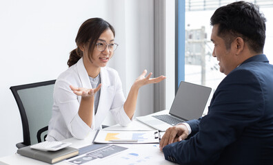 President and the marketing staff of the company convened the earnings revenue and analysis of real estate data graph in the office, Brainstorming ideas about finance and accounting concept.