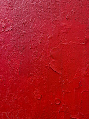 Abstract  background  of old red paint on the wall.