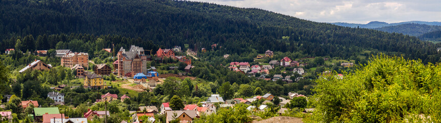 Fototapeta na wymiar big unfinished cottages in the valley in the Ukrainian Carpathians
