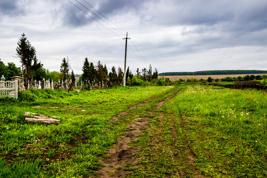 A Rural Road Between The Old Cemetary And Arable Field