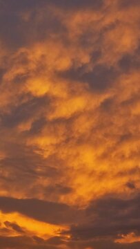 Sunset time-lapse - Clouds are moving by - Vertical composition