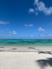 Obraz premium TURQUOISE WATER, PUNTA CANA BEACH, PARADISE, BLUE SKY, WITH SOME CLOUDS - DOMINICAN REPUBLICAN, FEBRUARY, 2020