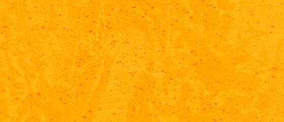 Abstract yellow or orange stucco wall texture, Painted scratched orange grunge texture, colorful bright yellow or orange background in distressed vintage textured design.