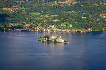 Panoramic view of the lake Orta and the natural landscape of the hills surrounding Orta San Giulio, Italy.