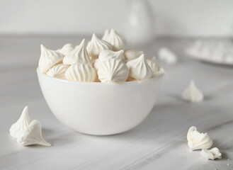 French dessert Meringue prepared from whipped with sugar and baked eggs. A cup of home-made meringues